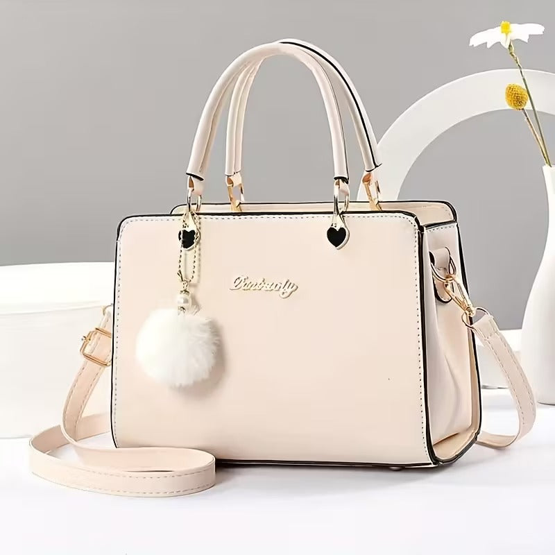 A Stylish Solid Color Handbag with Pom-Pom Decorations